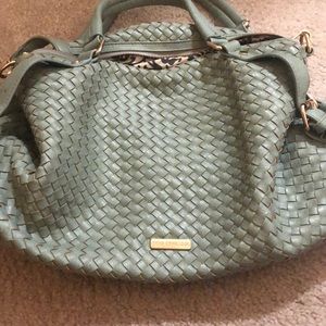 strap that can be removed to wear as a crossbody